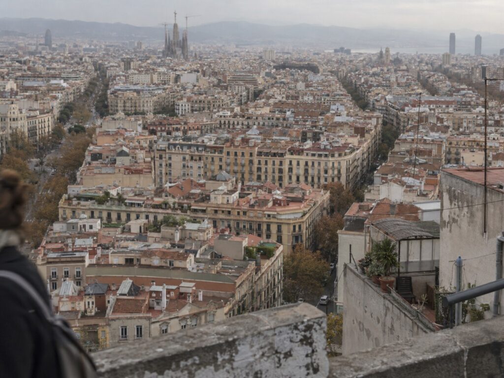 Rooftop view across the Eixample with the Sagrada Familia on the skyline